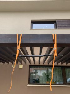 homemade DIY pull-up bar hanging from pergola on straps