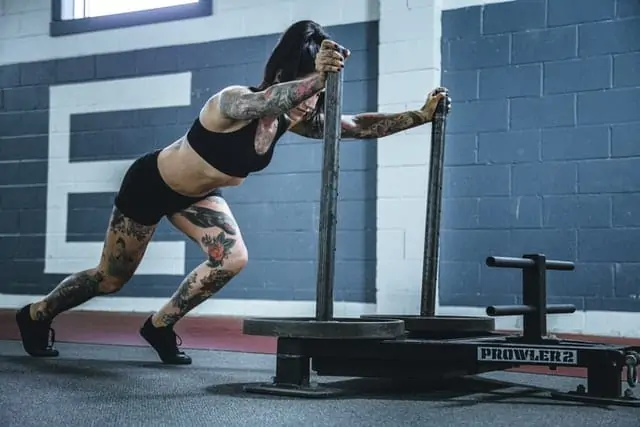 Weighted sled push workout