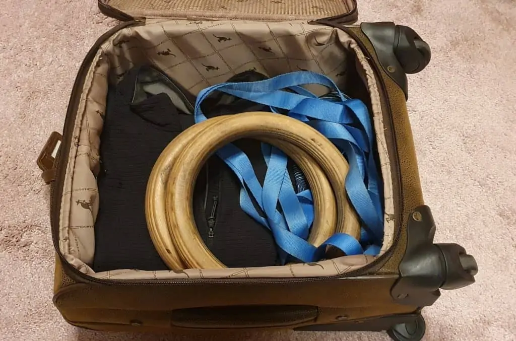 A pair of gymnastic rings perfectly fitting into a suitcase